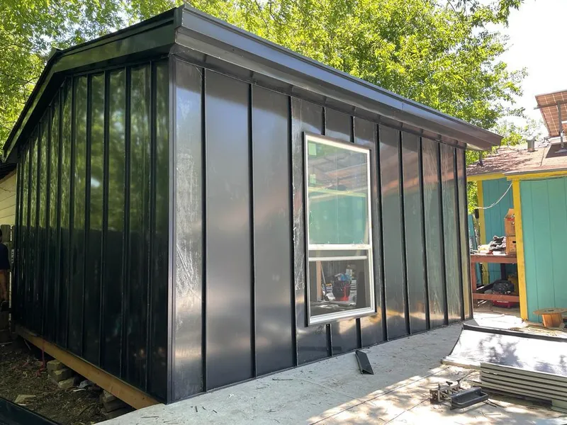 Black standing seam metal wall panels for Roof Inspection in Livingston